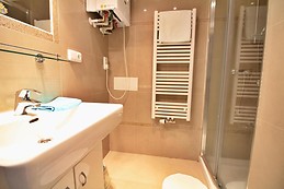 Large room with big bed and sofa