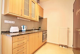 Large room with big bed and sofa