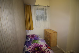 Furnished bedroom with window to street in the ground floor