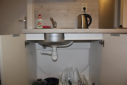 Furnished bedroom with window in the ground floor