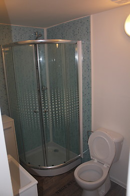 Furnished bedroom with window in the ground floor