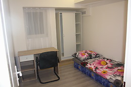 Furnished bedroom with window in the ground floor
