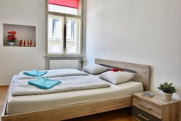Large room with big bed and sofa