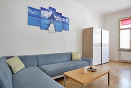 Large room with big bed and sofa