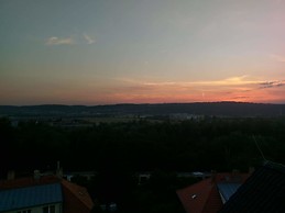 Quaint room with stunning views in sunny apartment.