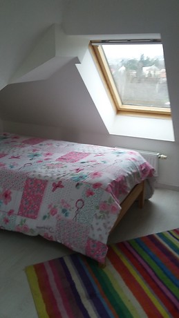 Quaint room with stunning views in sunny apartment.