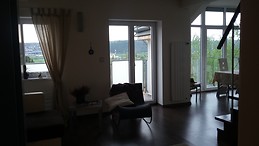 Quaint room with stunning views in sunny apartment.