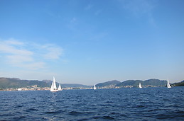 Bergen city centre at distance, as viewed from a boat in Byfjorden fjord. May 2012