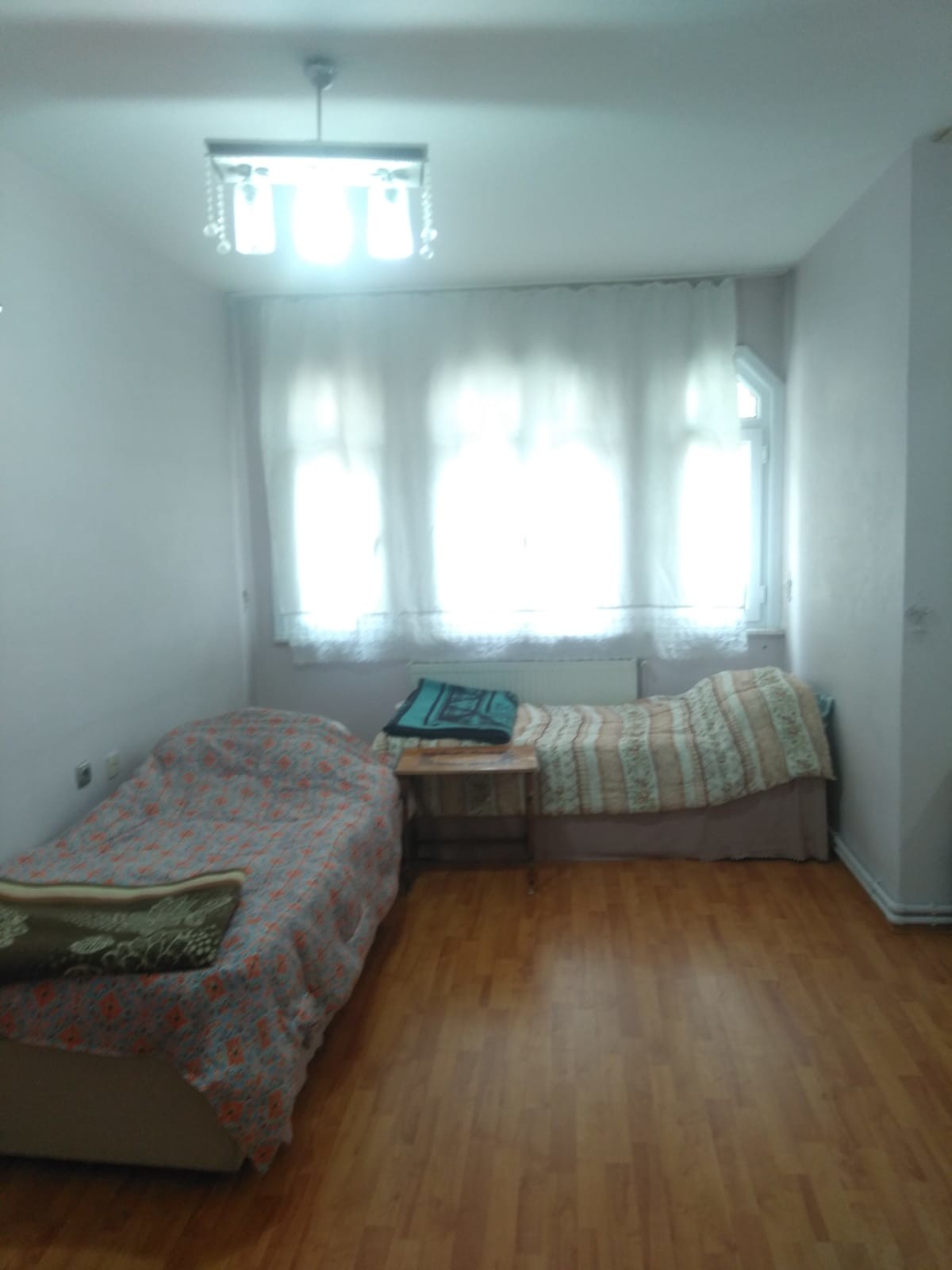 A room for rent( 200 a month) within the apartment contains three
