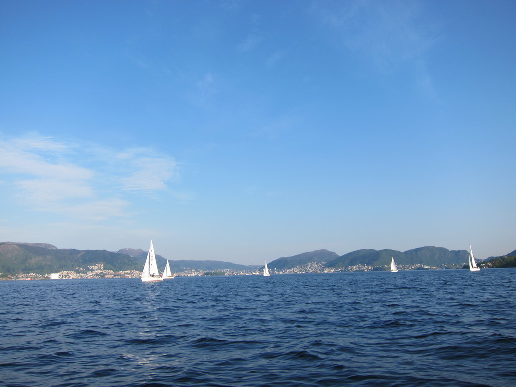 Bergen city centre at distance, as viewed from a boat in Byfjorden fjord. May 2012